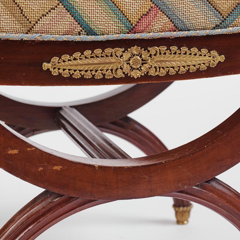 A French Empire-style mahogany stool, late 19th century.