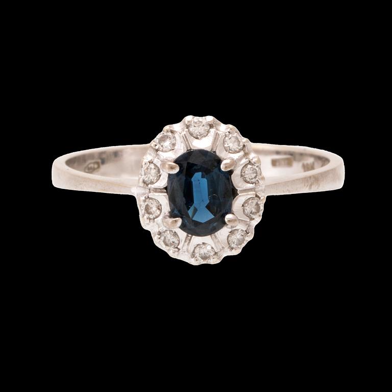 An 18K white gold carmosé ring set with an oval faceted sapphire and round brilliant-cut diamonds, Alessandria Italy.