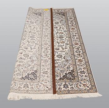 A carpet, Nain part silk so called 6 LAA, signed, ca 240 x 137 cm.