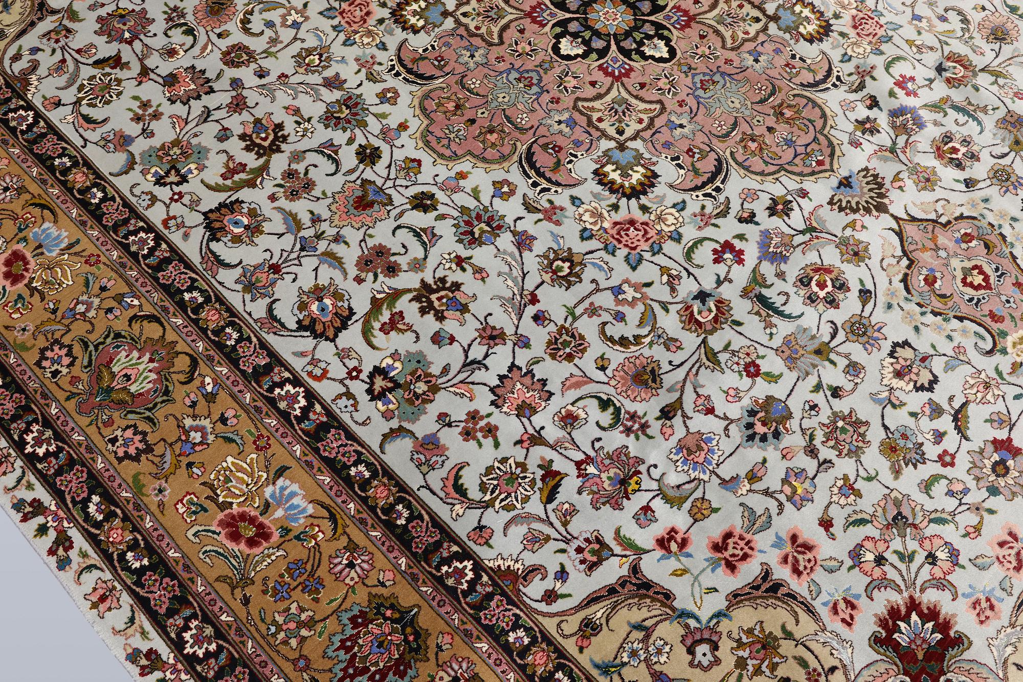 A Tabriz carpet, part silk, so-called 50 Raj, approx. 348 x 252 cm.