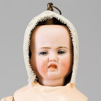 A bisque head multi-face doll, Germany, 1910s.