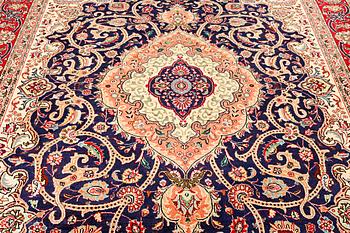 A Tabriz carpet, c. 345 x 255 cm.