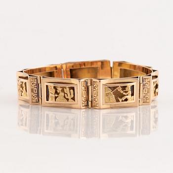 Gold panel bracelet.
