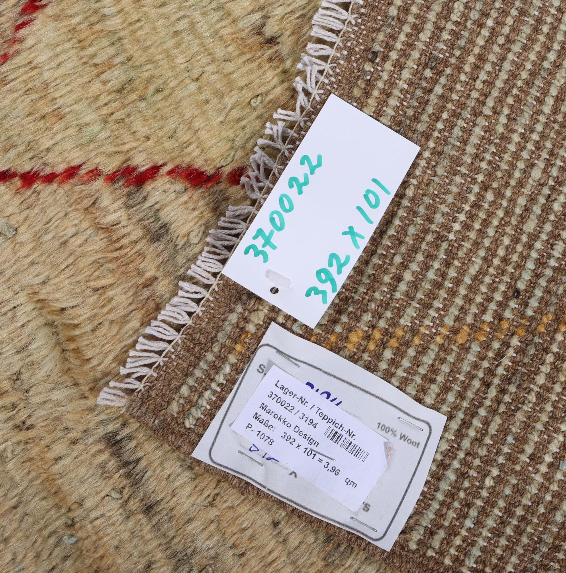 A runner carpet, Morocco, c. 392 x 101 cm.