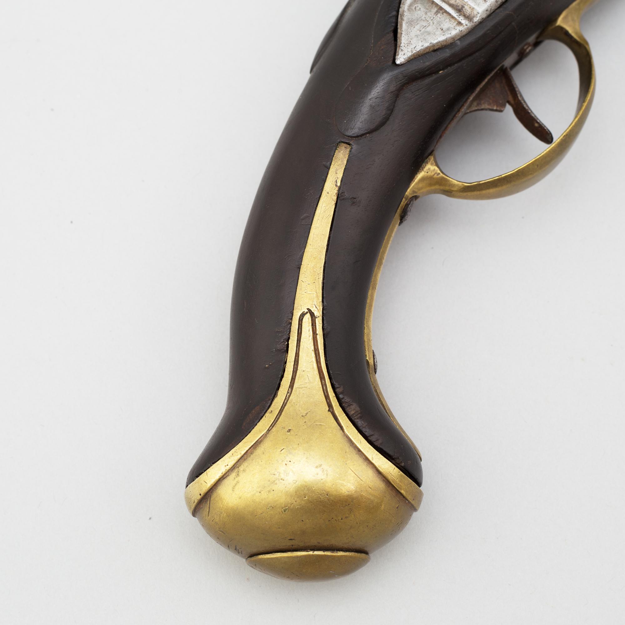 A 18th century flintlock pistol.
