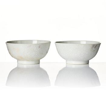 A pair of white glazed lotus bowls, Qing dynasty, 18th century.