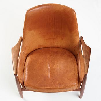 Ib Kofod-Larsen, a "Seal" teak and brown leather armchair, Olof Persson Möbler, Jönköping, Sweden 1950-60's.