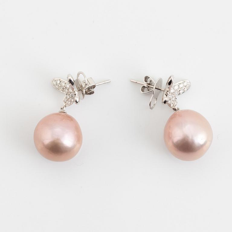 Pink freshwater pearl and brilliant cut diamond butterfly earrings.