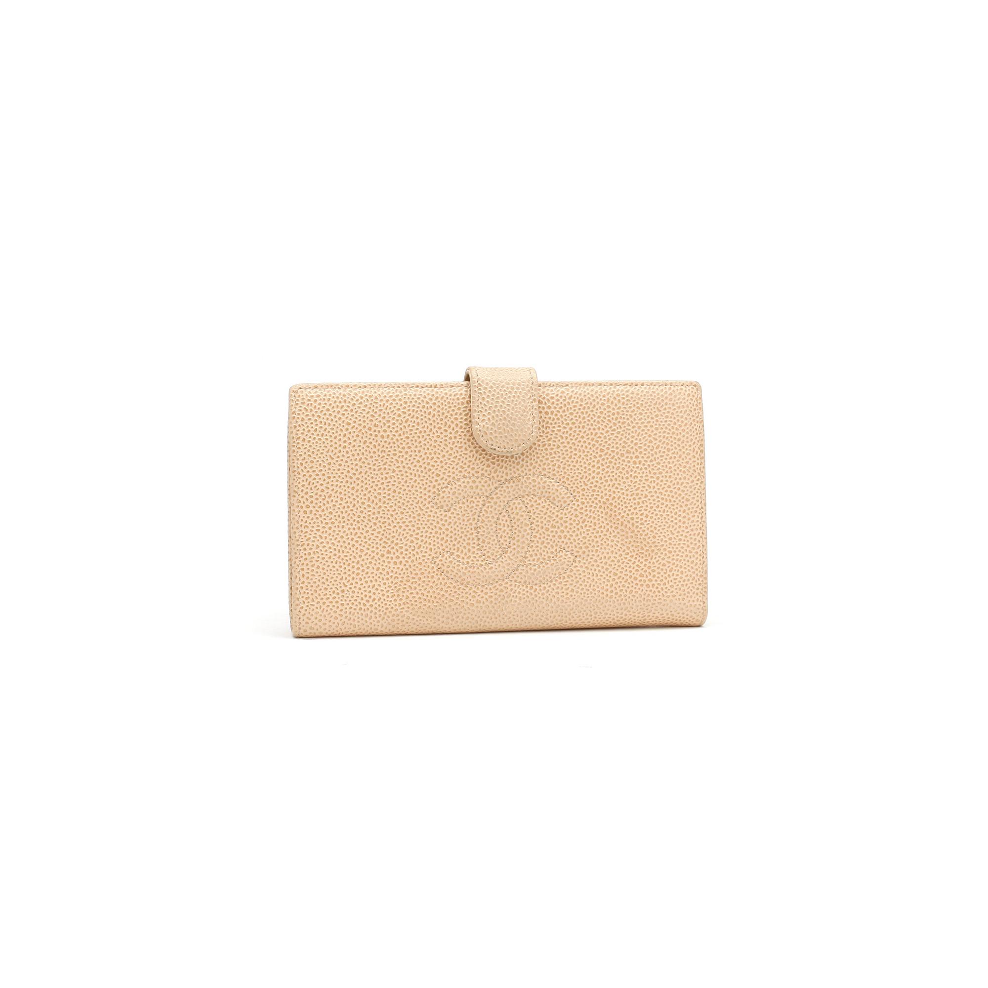 CHANEL, a beige caviar leather wallet.