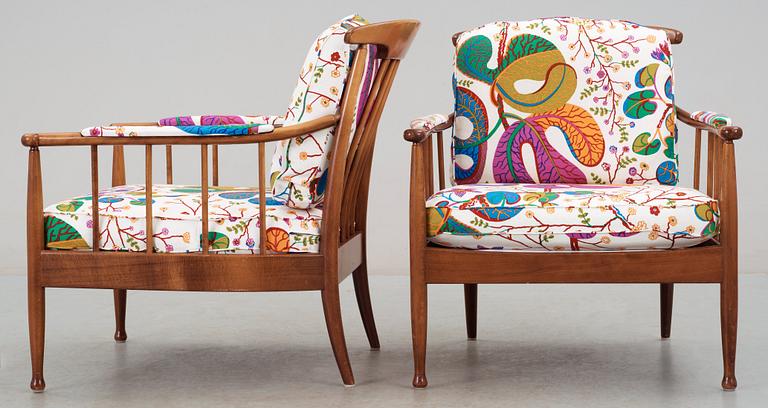 A pair of Kerstin Hörlin Holmquist mahogany arm chairs 'Skrindan', by OPE-möbler.