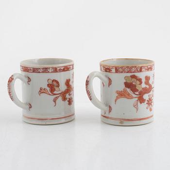 A pair of cups with ears and a cup with saucer, porcelain, -china, Qing dynasty, 18th century.