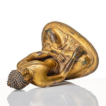 A gilt copper alloy figure of buddha, Nepal, 18th Century.