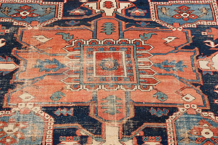 An antique Heriz carpet, ca 350 x 317 cm.