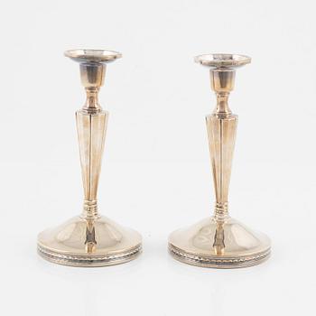 Eric Löfman, a pair of silver candlesticks, MGAB, Uppsala, 1976.