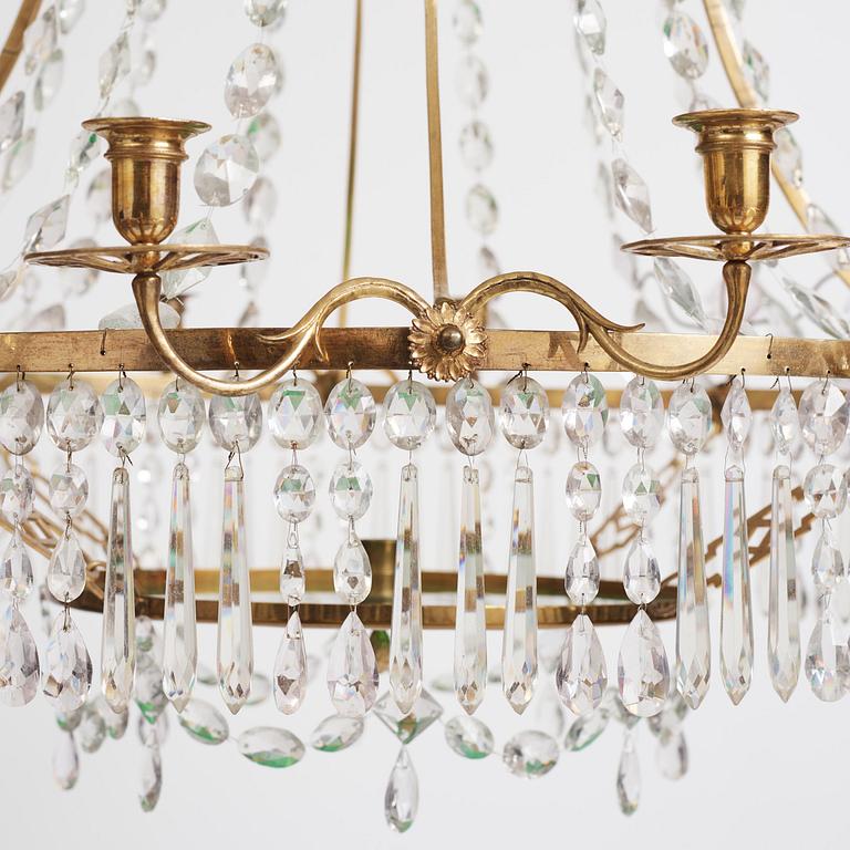A German Louis XVI ormolu and cut-glass nine-light chandelier attributed to Johann Christoph Ermisch, late 18th century.