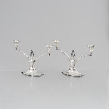 A pair of silver candelabra, Swedish import marks, probably 1920's/30's.