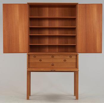 A Carl Malmsten mahogany cabinet with inlays of different types of wood, signed and dated 1958.