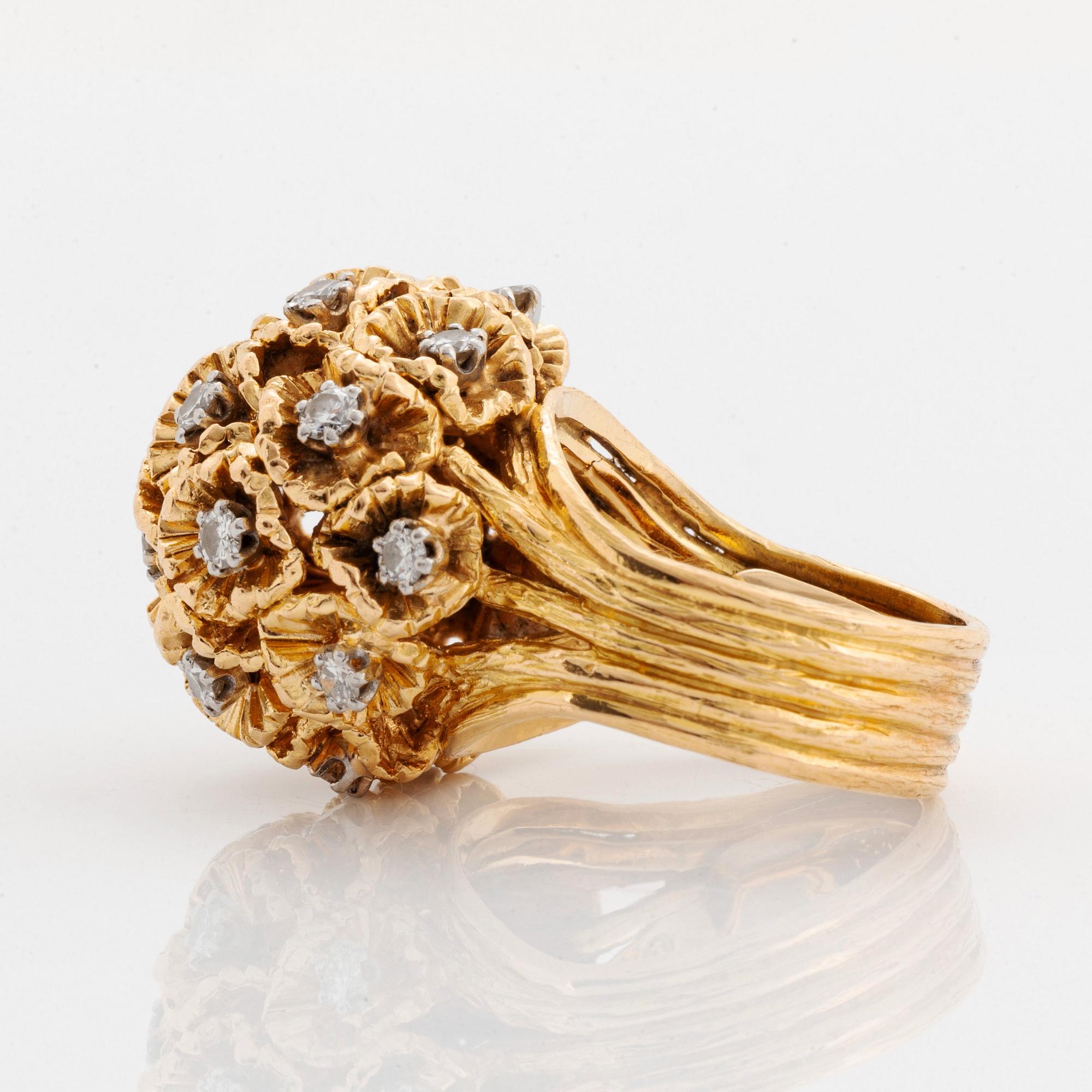 A WA Bolin ring in 18K gold set with round brilliant-cut diamonds.