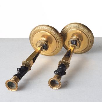 A pair of Empire style candlesticks. Late 19th century.