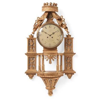104. A late Gustavian giltwood cartel clock by E. Rundelius (watchmaker in Stockholm 1793-1815).