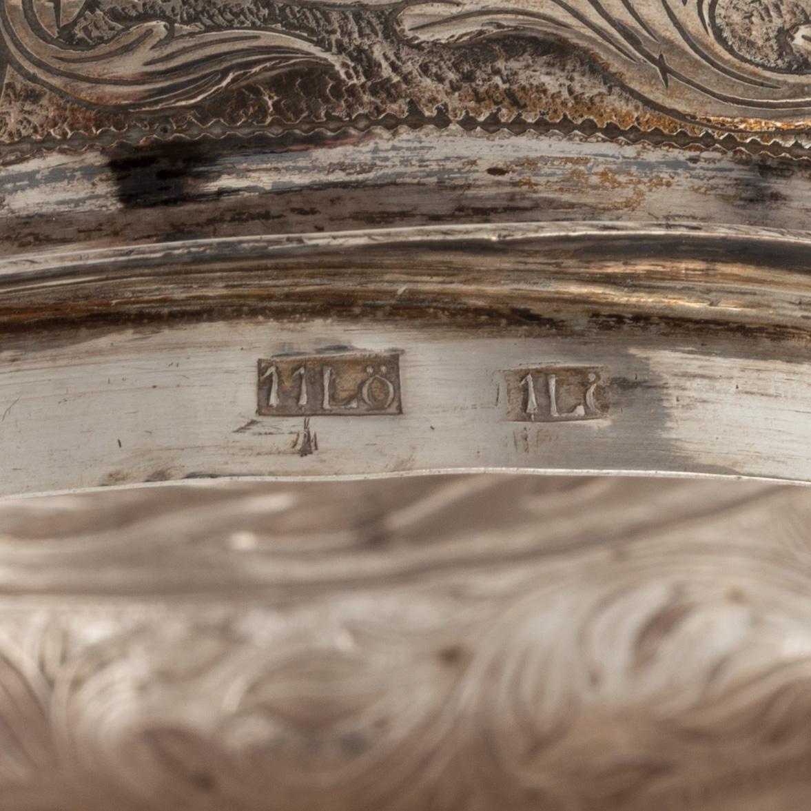 A glass tankard with mount of low fineness silver, 19-20th century.