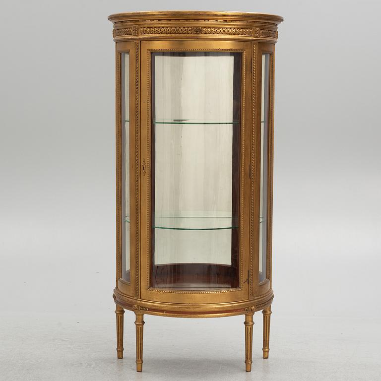 A Louis XVI-style display cabinet, circa 1900.