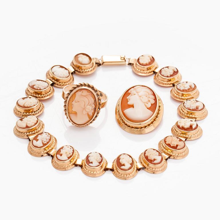 A 14K gold and shell cameo jewelry set, bracelet, pendant/brooch and ring.