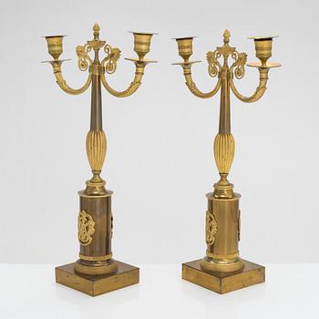 A pair of brass candelabra, early 20th century.