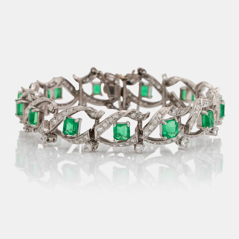 A platinum bracelet set with step-cut emeralds with a total weight of ca 12.50 cts.