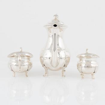 A Norwegian Silver Coffee Pot, Creamer and Sugar Bowl, mark of David Andersen, Oslo, mid-20th Century.