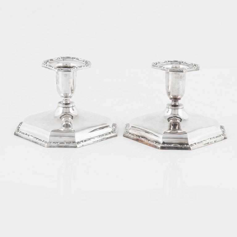 A Swedish Silver Ladle, mark of Adolf Öström, Piteå 1887 and a pair of Silver Candlesticks.