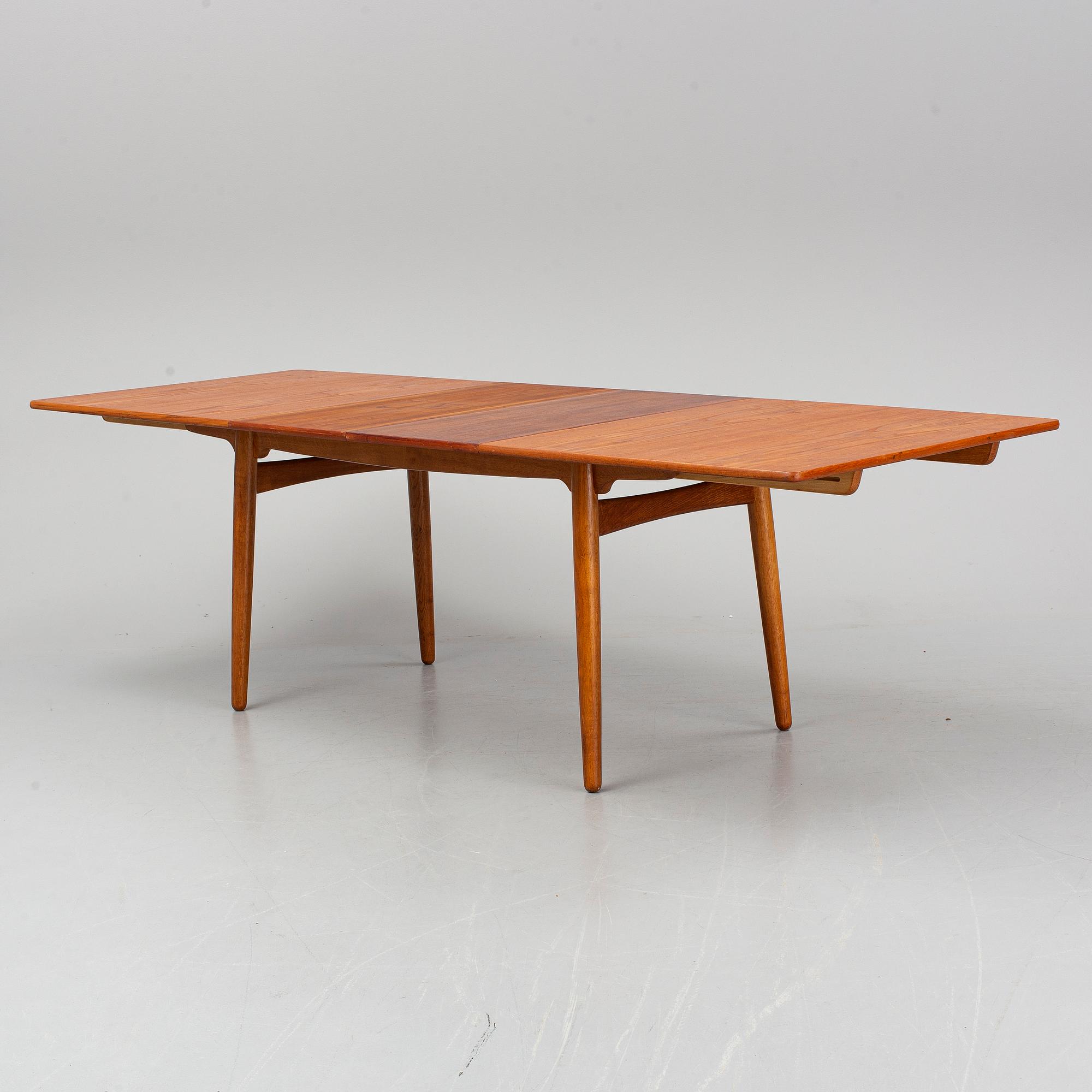A dining table by Hans J Wegner Andr. Tuck Denmark 1960s. Bukowskis