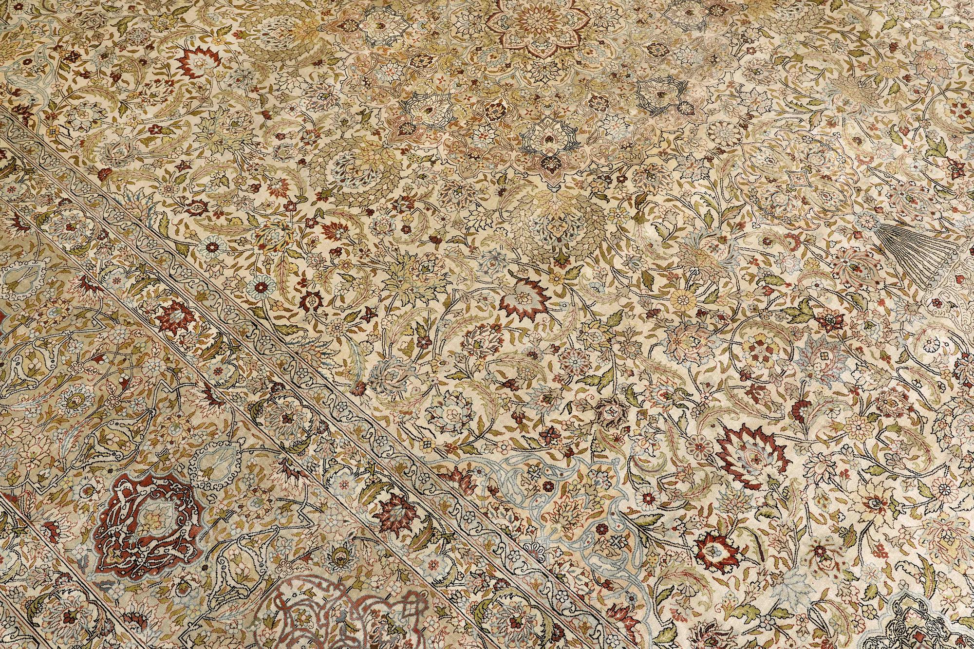 A oriental silk carpet, 350 x 247 cm.