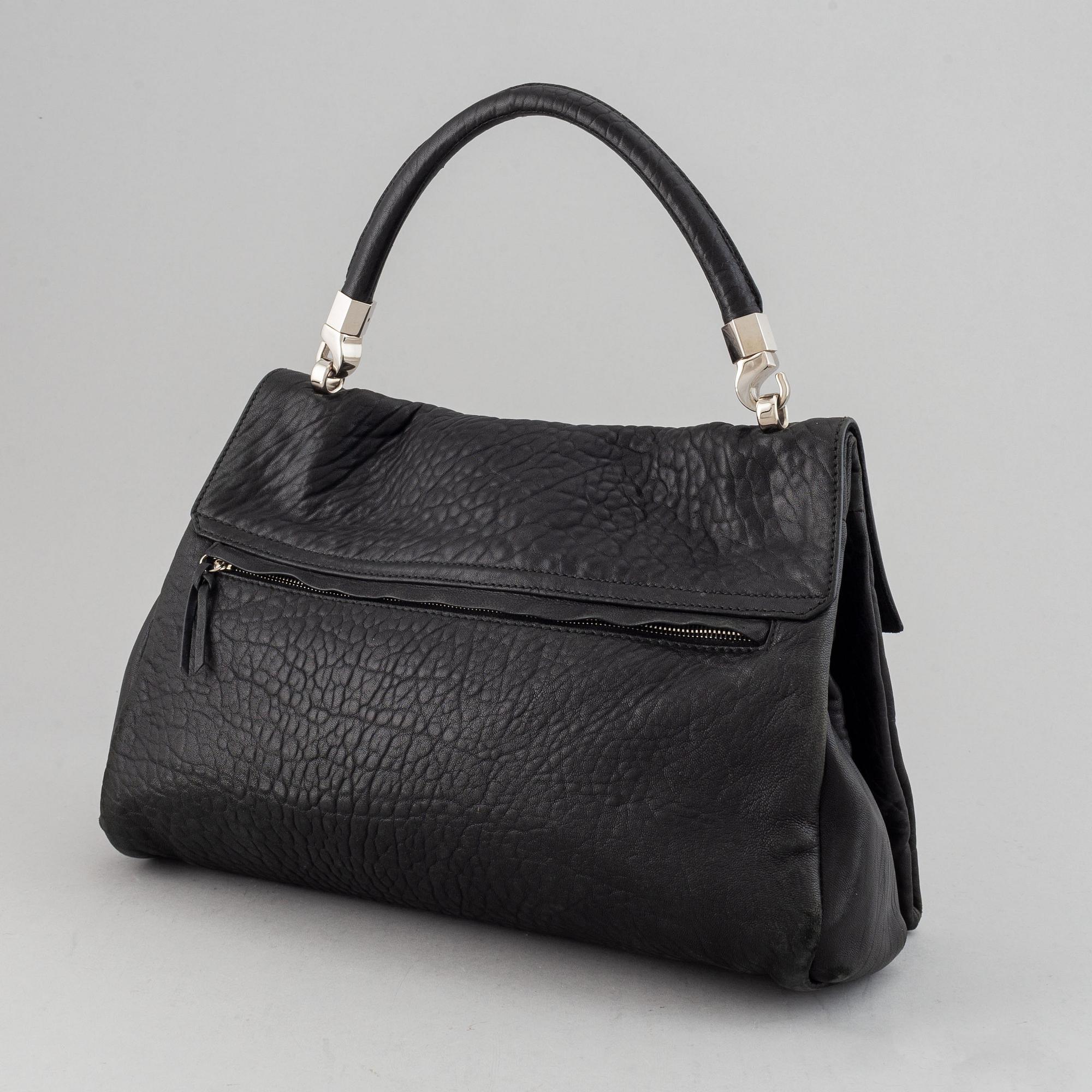 Yves Saint Laurent, a black leather bag.