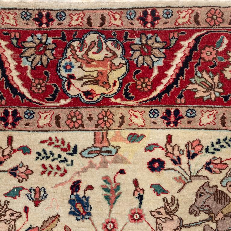 An oriental, figural rug, c. 230 x 145 cm.