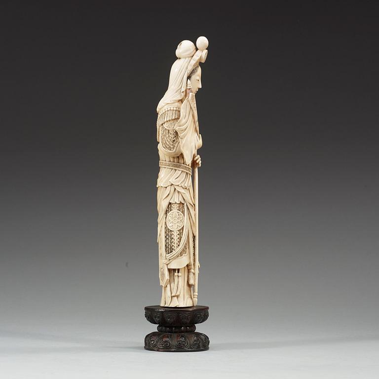 A partly tinted carved ivory figure of the female warrior Mulan, Qing Dynasty, 19th Century.
