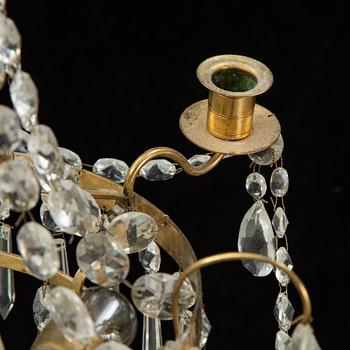 A small Swedish 20th century empire style chandelier for three candles.