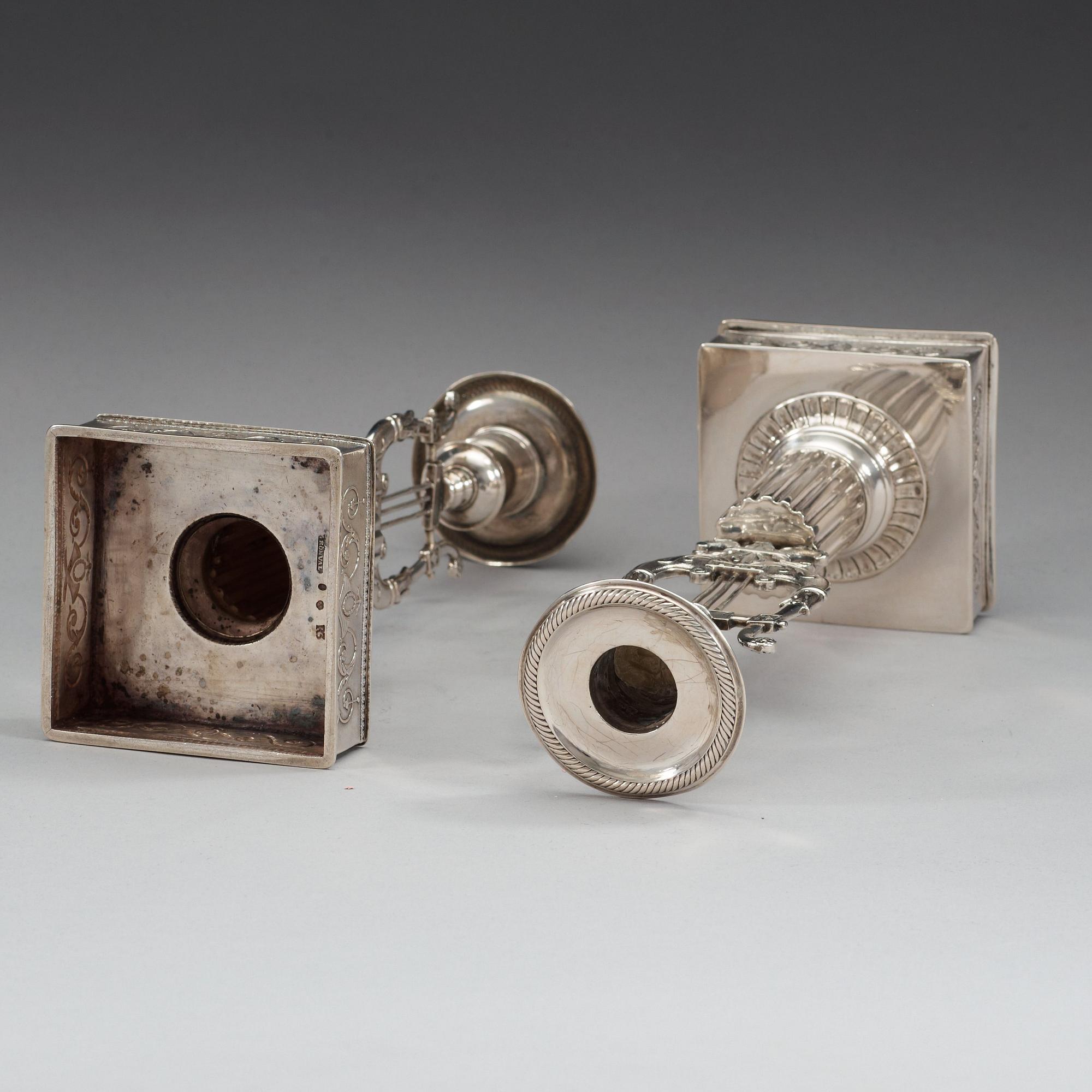 A pair of Swedish 19th century silver candlesticks, makers mark of Johan Petter Grönvall, Stockholm 1823.