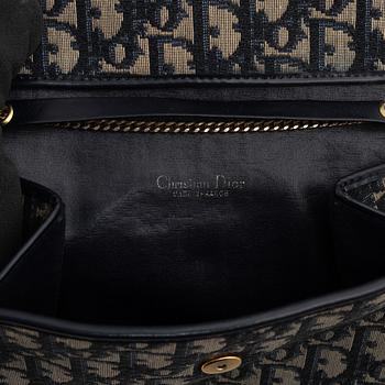 Christian Dior, a handbag/clutch.