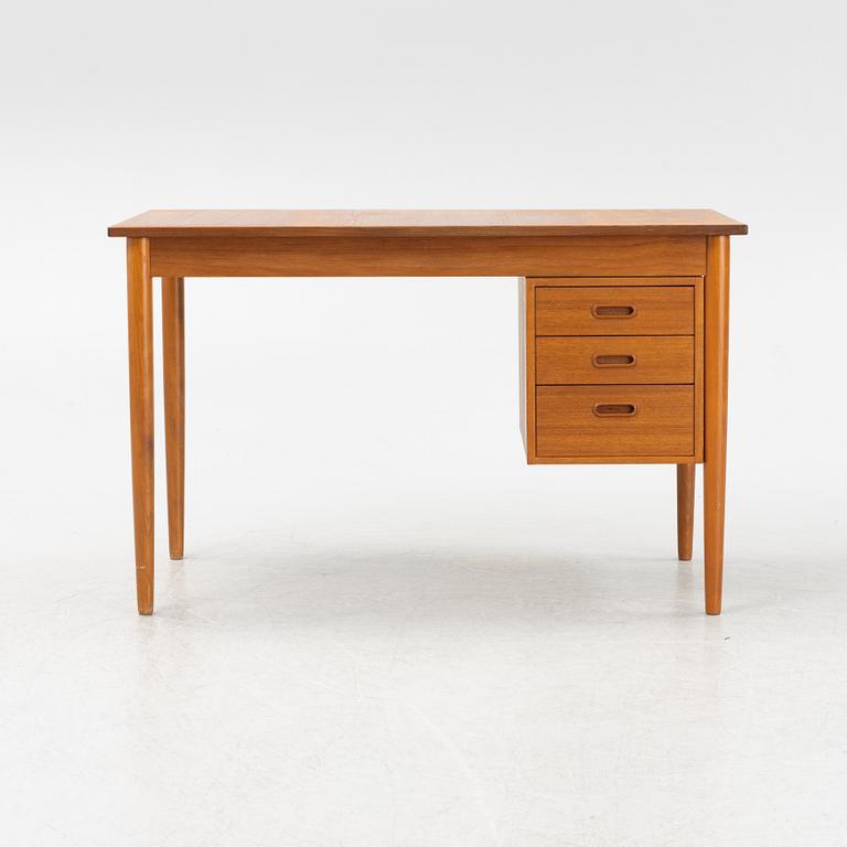 A teak veneered desk, 1950's/60's.