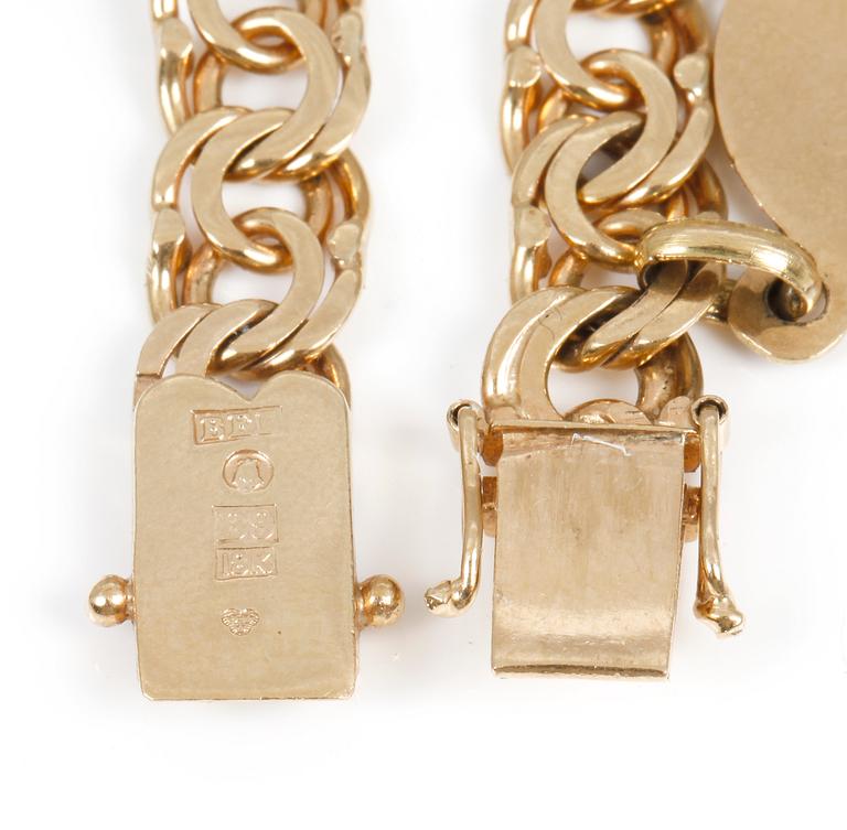 ARMBAND, 18 k guld, med ametist, 1952. Totalvikt ca 21 gram.
