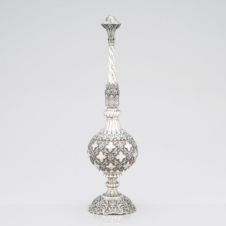 An 1880's british Raj repoussé silver rosewater sprinkler by Oomersi Mawji & Sons.