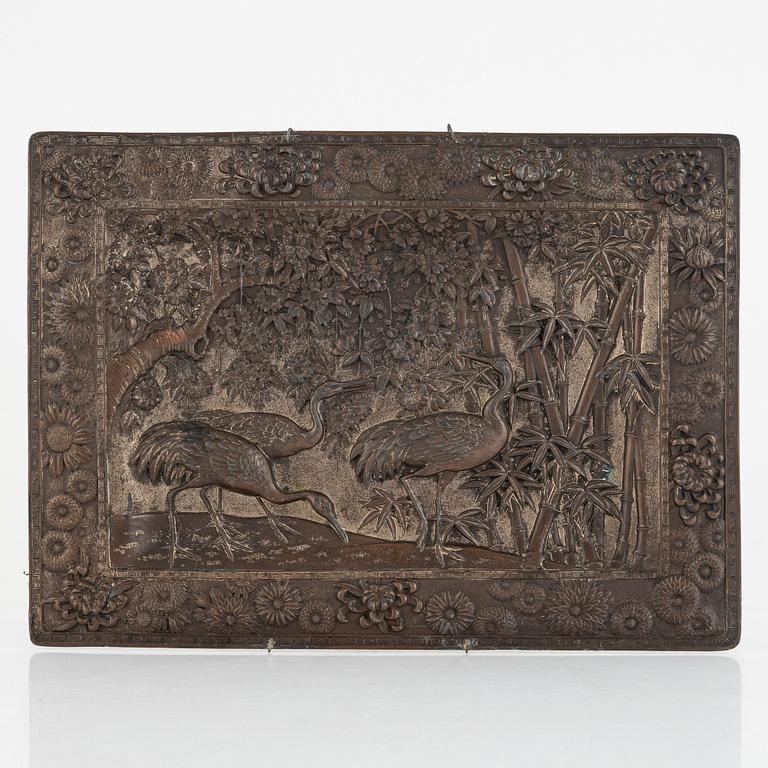 A Chinese copper relief, 20th century.