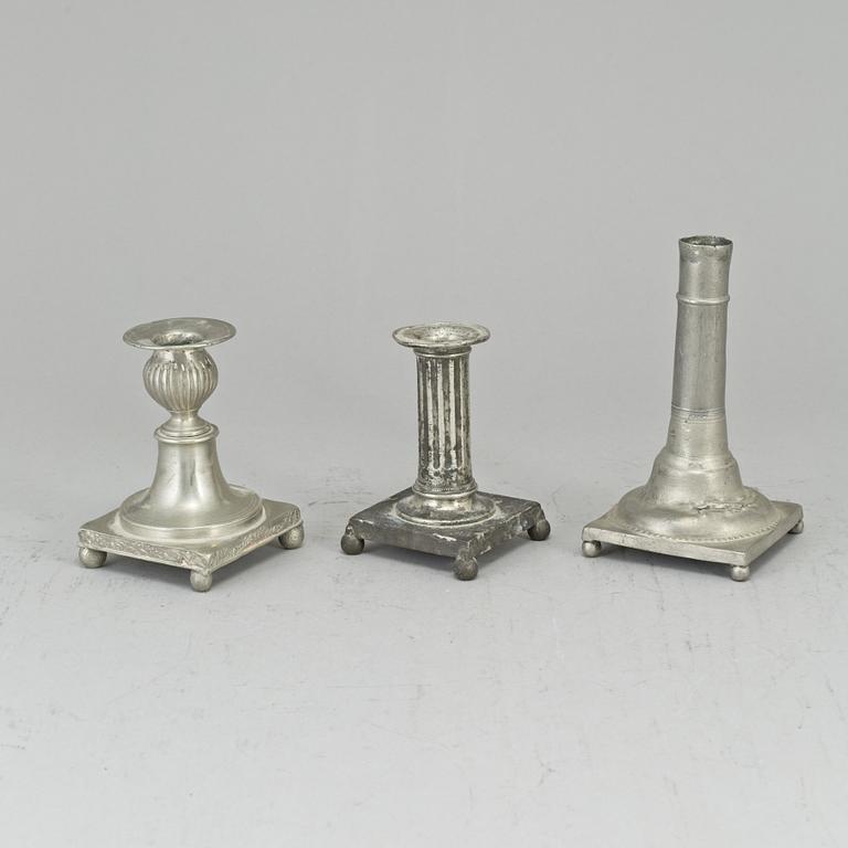 Three 19th century gustavian pewter candlesticks.