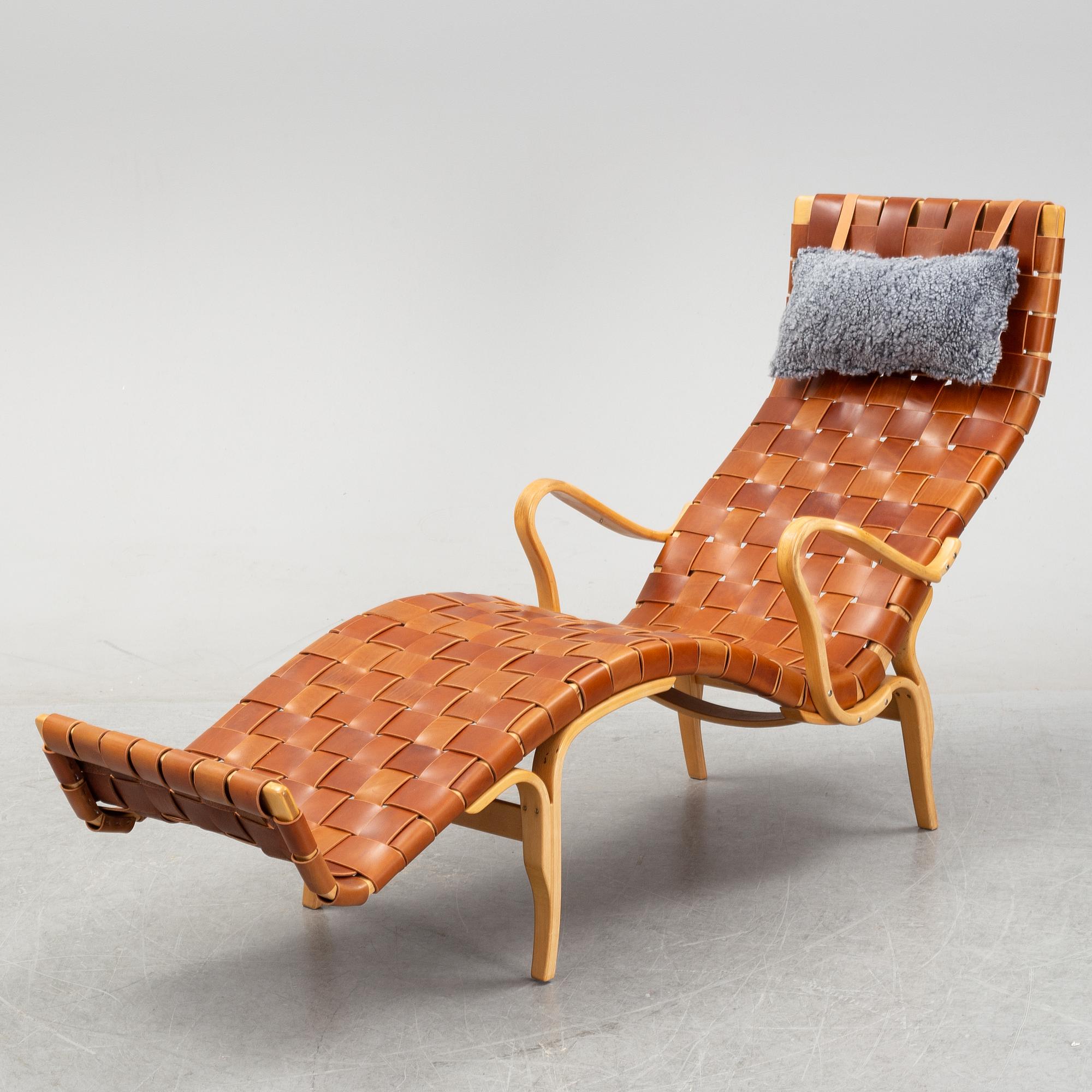 A 'Pernilla 3' lounge chair by Bruno Mathsson for Firma Karl Mathsson, dated 1973.