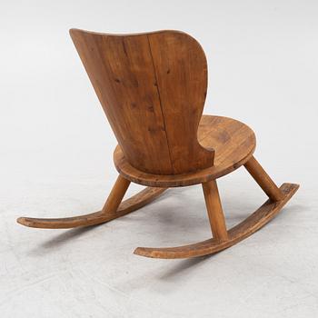 A 1940's pinewood rocking chair.