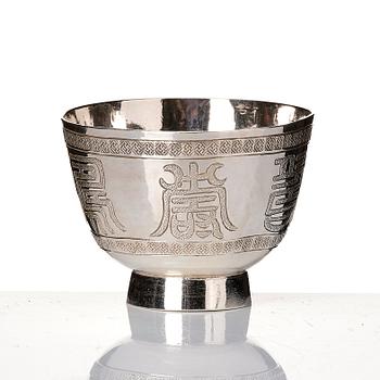 A set of six silver cups with holders, China, 20th century.