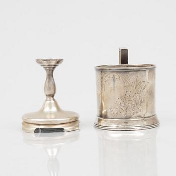 A Russian Silver Candlestick, 1908-26, and a Russian Silver Tea Glass Holder, assay master A. Skovronsky, Moscow 1896.