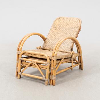 A mid 1900s rattan and bamboo garden chair.