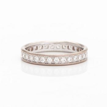 Cartier, an 18K whitegold eternity ring, with brilliant-cut diamonds.  With certificate.